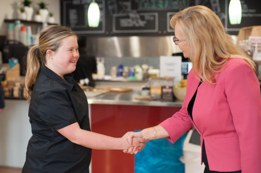 Anna and Shirley shaking hands