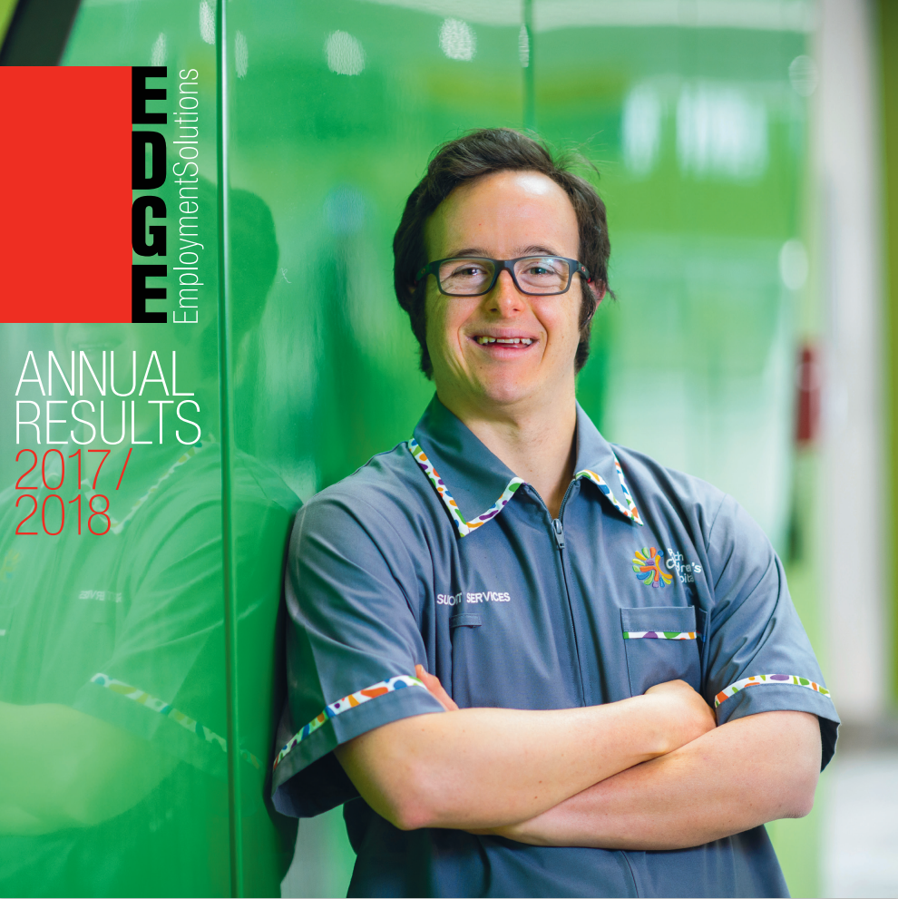 Annual report cover image of man leaning against wall smiling