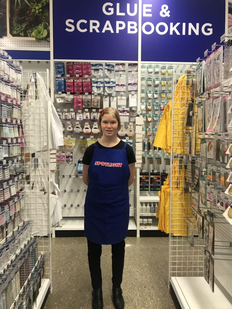Eloise standing in an isle at Spolight