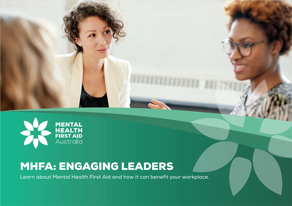A woman looking at another woman- with an overlay of graphic. With text- MHFA: Engaging Leaders. Learn about Mental Health First Aid and how it can benefit your workplace.