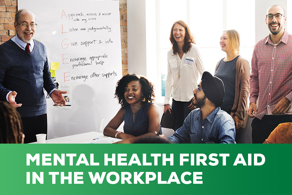 Image of man gesturing to five people with the text, Mental Health First Aid in the Workplace.